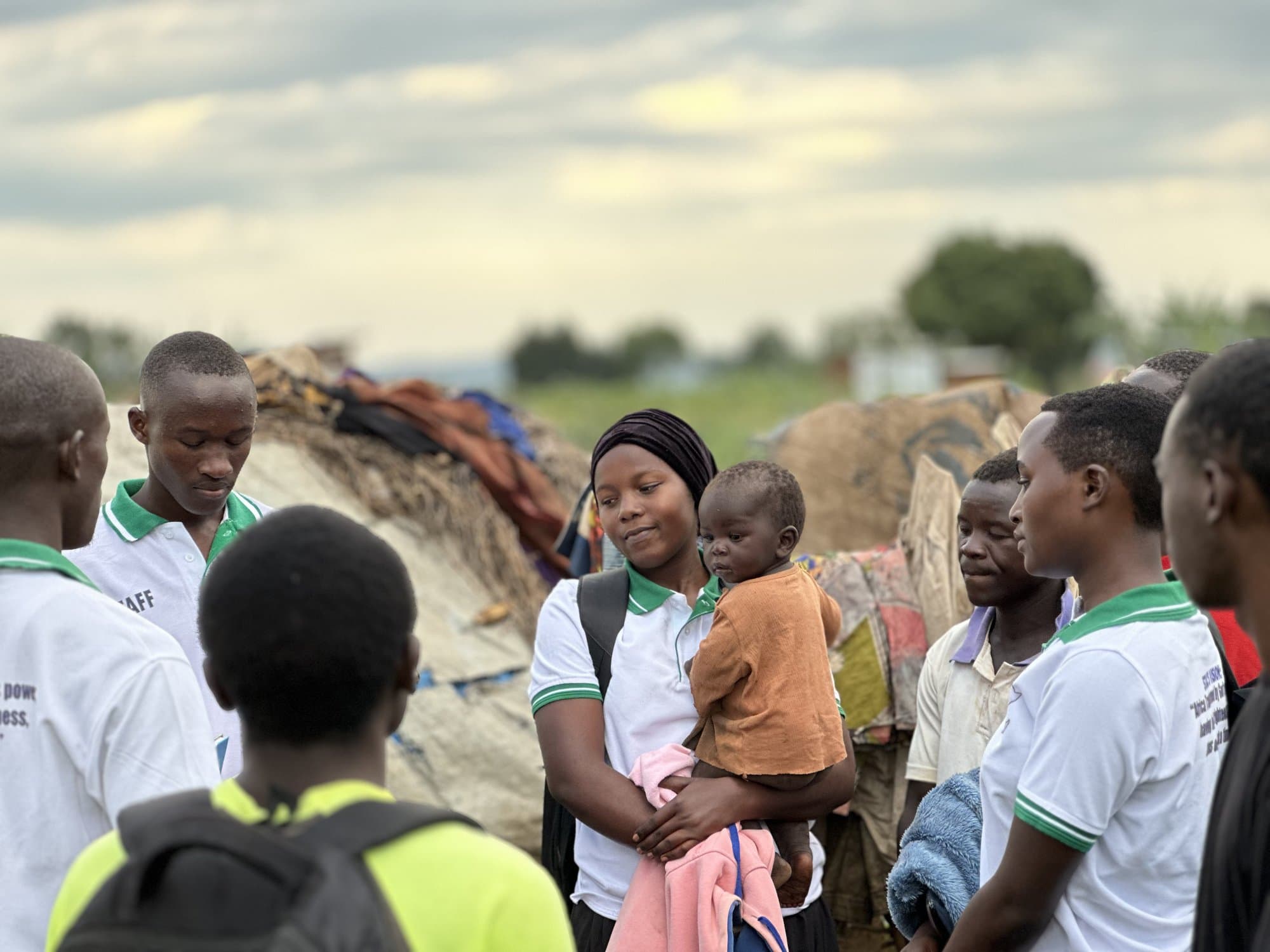 STAC team visiting a family home in Kyangwali Refugee Settlement