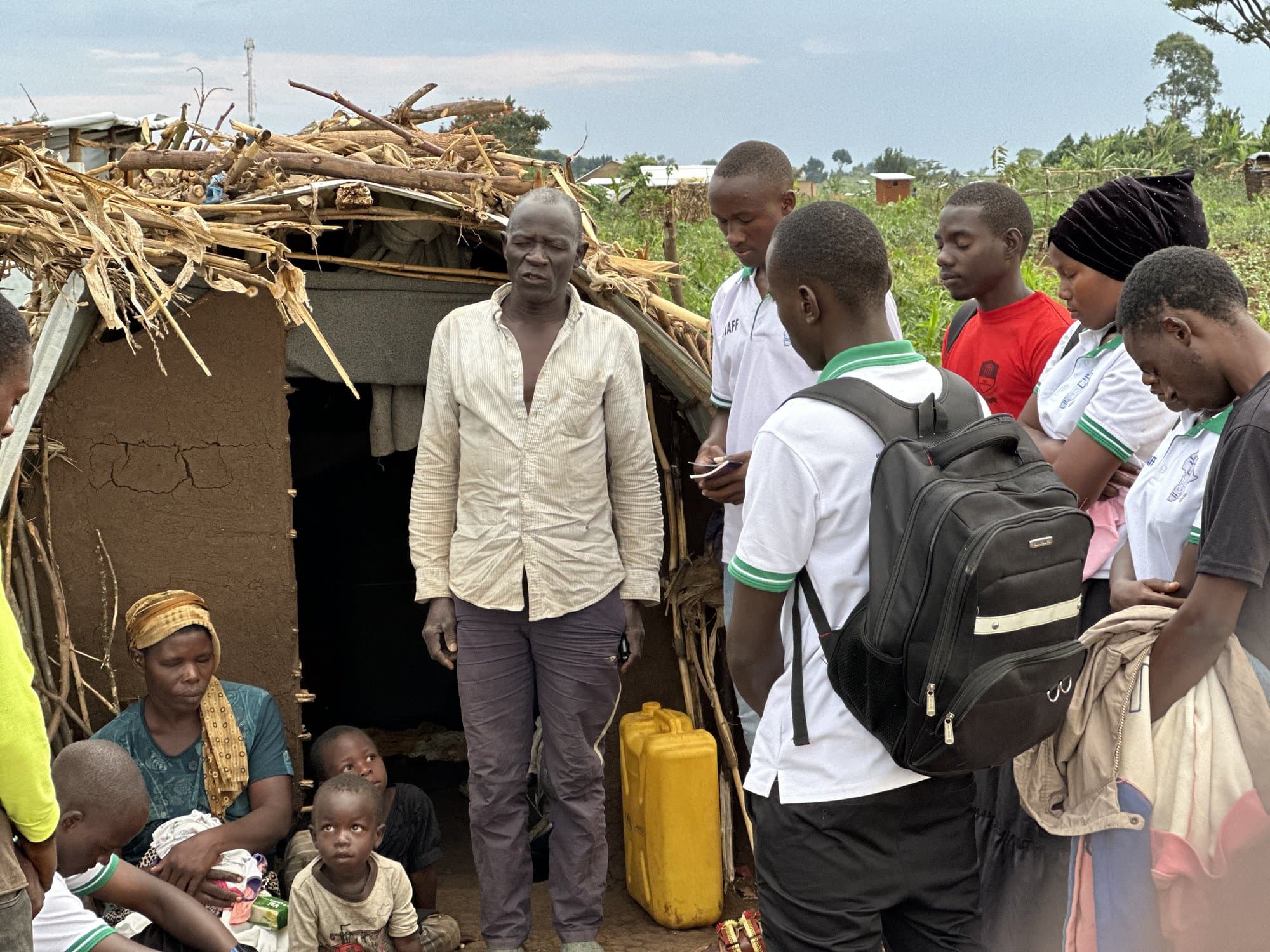 STAC team members visiting a family in the community