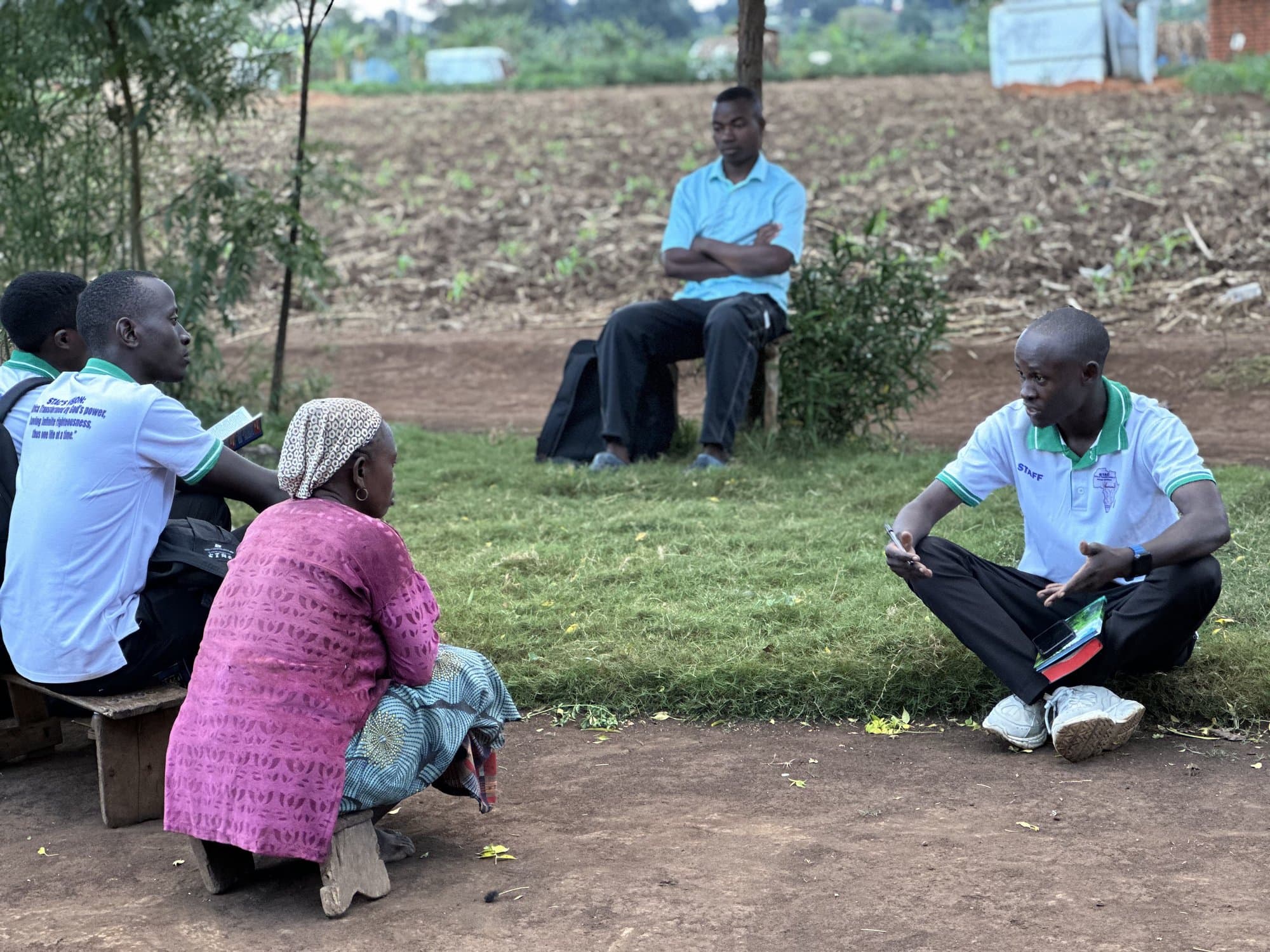 STAC team member spending time with a community elder